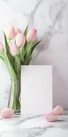 Elegant still life with pink tulips and blank card on marble surface for design inspiration photo