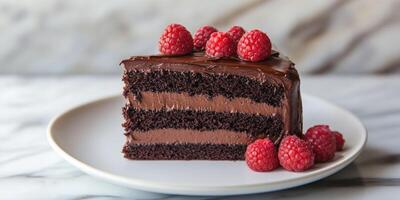 Indulgent slice of dark chocolate cake with raspberries for dessert inspiration photo