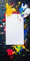 Creative blank canvas with vibrant paint splatters on dark background for artistic projects photo
