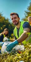 Team of volunteers collecting trash in a park for environmental cleanup and community service photo