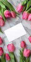 Ultra realistic greeting card mockup with pink tulips on marble background for elegant designs photo