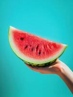 Vibrant summer enjoyment with fresh watermelon slice against blue sky photo