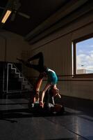 A man and a woman dancing in a dance studio. photo