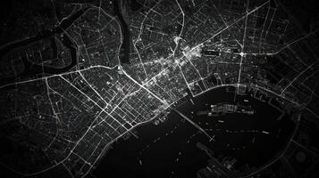 Aerial view of a city map at night in a black and white style. photo