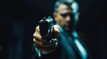 Focused portrait of a man aiming a handgun, creating a tense atmosphere. photo