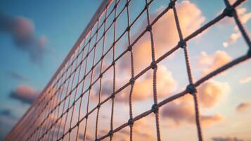 A close-up of a net against a colorful sunset sky. photo