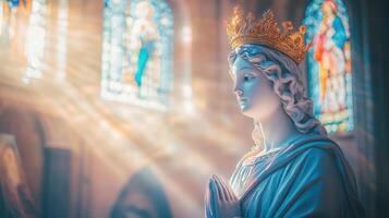A serene statue of a crowned figure bathed in soft light. photo