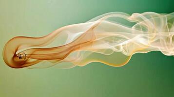 A serene swirl of colorful smoke flowing gracefully against a soft backdrop. photo