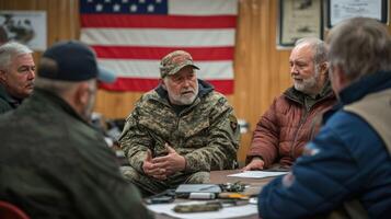 A group of veterans discussing strategy around a table indoors. photo