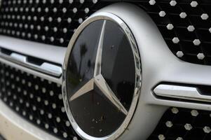 Gaziveren Cyprus -17.03.2025 Mercedes-AMG Elegance in motion Close-up of a luxury automobile emblem reflecting adventure and craftsmanship on a sunny day photo