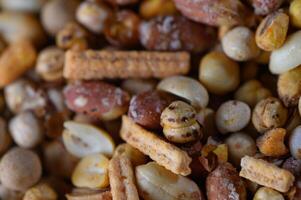 Colorful assortment of crunchy snacks invites delightful munching during a casual gathering photo