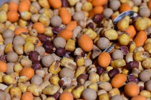 Colorful blend of seeds and grains creating a vibrant natural display for wildlife feeding photo