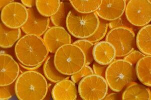Bright citrus slices create a vibrant display of freshness and color in a summer kitchen setting photo