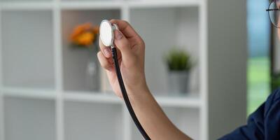 Stethoscope and Patient Monitoring. A medical student preparing to check vital signs with a stethoscope in hand. photo