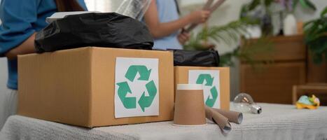Recycling and Eco-Friendly Practices. A family engaging in sustainable activities by sorting recyclables together. photo