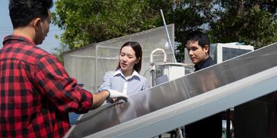 Sustainable Solutions and Team Dynamics. A contractor discusses solar panel technology with partners, emphasizing learning and collaboration in renewable energy. photo