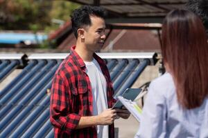 Client Interaction and Solar Energy Education. A technician shares insights on solar energy with clients during a site visit. photo