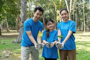 Sustainable Practices and Community Engagement. A joyful group of volunteers uniting for a greener planet by planting trees. photo