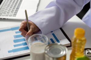 Nutrition Insights and Dietary Management. A healthcare professional analyzing data and suggesting nutritional improvements. photo