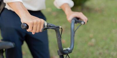 Cycling and Control. A focused individual grips the handlebars of a bicycle, ready for an adventure. photo