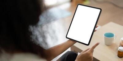 Telemedicine and Health Management. An individual using a tablet to connect with healthcare services, enhancing medication adherence. photo