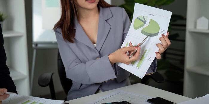 Presentation and Analysis. A professional explaining financial insights with charts. photo