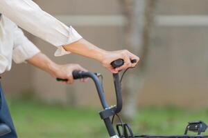 Bicycle Handling and Awareness. Close-up of hands on bicycle handlebars, emphasizing control and safety. photo