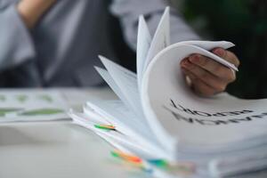 Documentation and Reporting. A professional handling multiple financial reports. photo