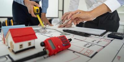 Design and Collaboration. Team actively engaged in drafting building layouts and discussing architectural features. photo