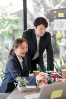 Sustainable Initiatives and Teamwork. Professionals brainstorming eco-friendly solutions in a collaborative environment. photo