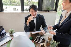 Sustainability and Innovative Solutions. Collaborative discussions on renewable energy projects within a dynamic office. photo