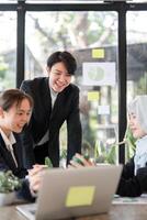 Eco-Friendly Solutions and Professional Growth. A team discussing innovative green strategies in a modern workspace. photo