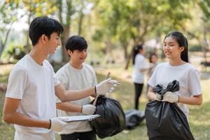 Volunteers discussing their cleanup efforts in a park, reinforcing teamwork and environmental commitment. photo
