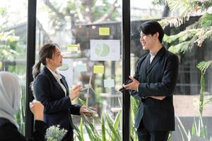 Sustainable Business Strategies and Collaboration. Professionals discussing eco-friendly solutions for their projects. photo
