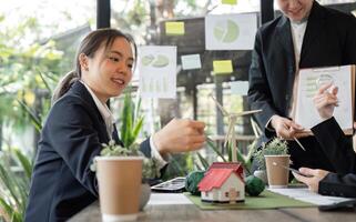 Team Strategy and Sustainable Innovations. Professionals working together to create sustainable solutions in a collaborative setting. photo