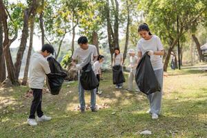 Community members engaged in a park cleanup, collecting trash and promoting environmental care. photo