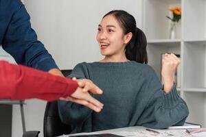 Excitement in Team Dynamics. A team member celebrates a victory during a strategy meeting. photo