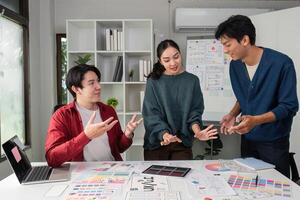 Dynamic Team Discussions and Creative Solutions. Colleagues share insights during a collaborative design meeting. photo