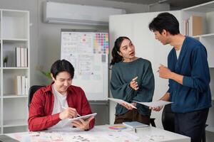 Team Collaboration in UIUX Development. Professionals discussing design strategies and user experience enhancement in a bright office environment. photo
