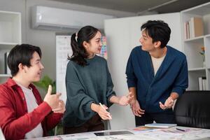 Collaboration and Creative Brainstorming. A dynamic team discussing UI and UX design ideas in a modern workspace. photo