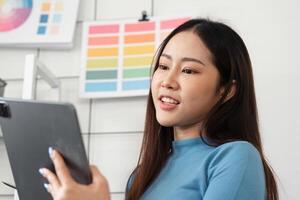 Interactive Color Application. A designer engaging with digital tools to finalize color choices. photo
