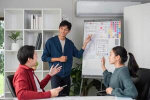 Interactive UI Presentation. A presenter engages the team while showcasing design layouts and features. photo