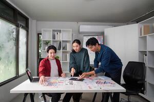 Teamwork and Design Process. Diverse designers collaborating on a UIUX project in a creative workspace. photo