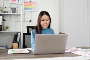 Design Process and Color Selection. A creative professional using a laptop to explore color combinations and design concepts. photo