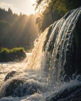 Waterfall cascades gently into serene river with sunlight filtering through trees photo
