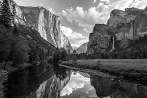 Stunning view of granite cliffs and reflections in river at Yosemite Valley during daylight hours photo