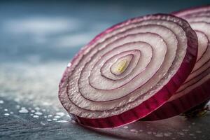 Slices of red onion displayed on a textured surface in natural light during midday photo