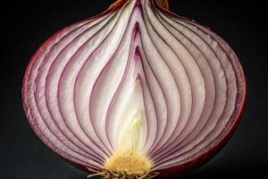 Cross-section of a red onion displaying intricate layers and distinctive colors photo
