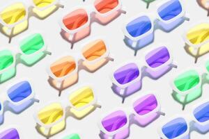 Pattern of rainbow colors sunglasses on white background at sunlight with shadow. Summer fashion eyeglasses with colored glass. Summer vacation, summer rest concept. Minimal style flat lay photo