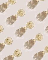 Top view of wineglasses with white wine with beautiful shadows at sunlight, minimal graphic pattern, summer alcohol drink background, trend creative aesthetic flat lay, trendly still life photo